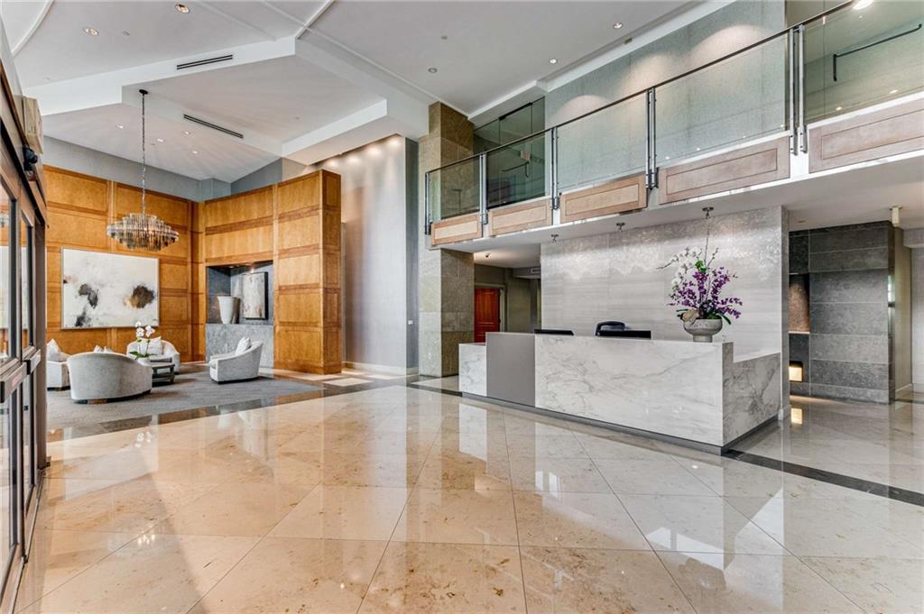 700 Park Regency Place Northeast, Unit 2201 Atlanta, GA 30326 - Photo 38 of 47 a lobby with furniture and large windows