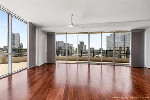 a view of an entryway with wooden floor