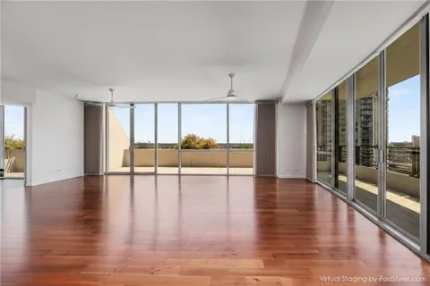 a view of an entryway with wooden floor