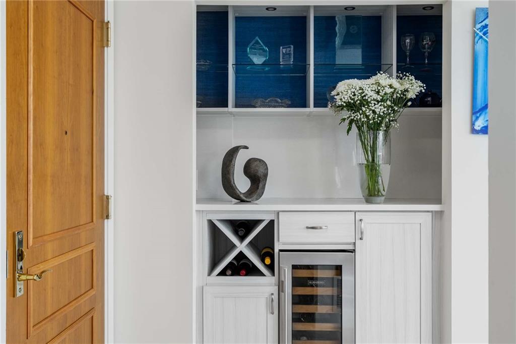 700 Park Regency Place Northeast, Unit 2201 Atlanta, GA 30326 - Photo 6 of 47 a vase of flowers sitting on a wooden door