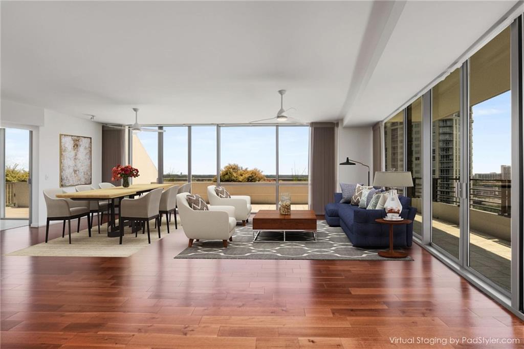 700 Park Regency Place Northeast, Unit 2201 Atlanta, GA 30326 - Photo 7 of 47 a living room with furniture and a large window