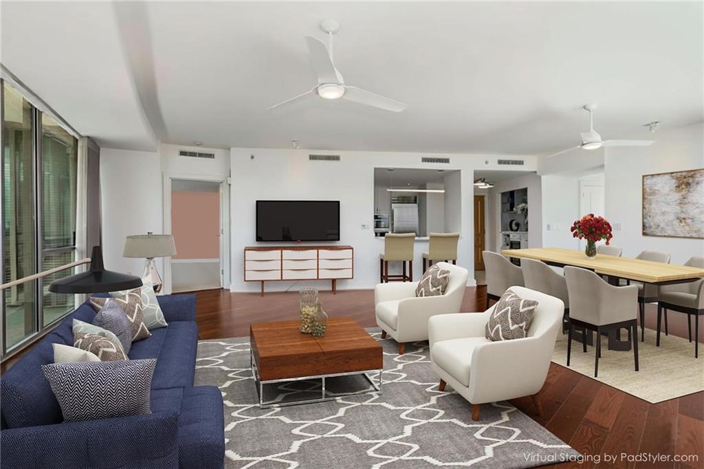 700 Park Regency Place Northeast, Unit 2201 Atlanta, GA 30326 - Photo 8 of 47 a living room with furniture and a flat screen tv