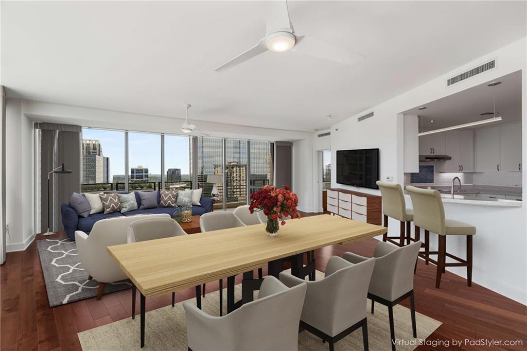 700 Park Regency Place Northeast, Unit 2201 Atlanta, GA 30326 - Photo 9 of 47 a view of a dining room with furniture and wooden floor