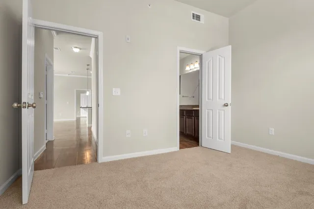 a view of a big room with closet and wooden floor