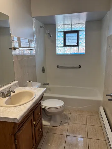 an empty room with wooden floor and closet