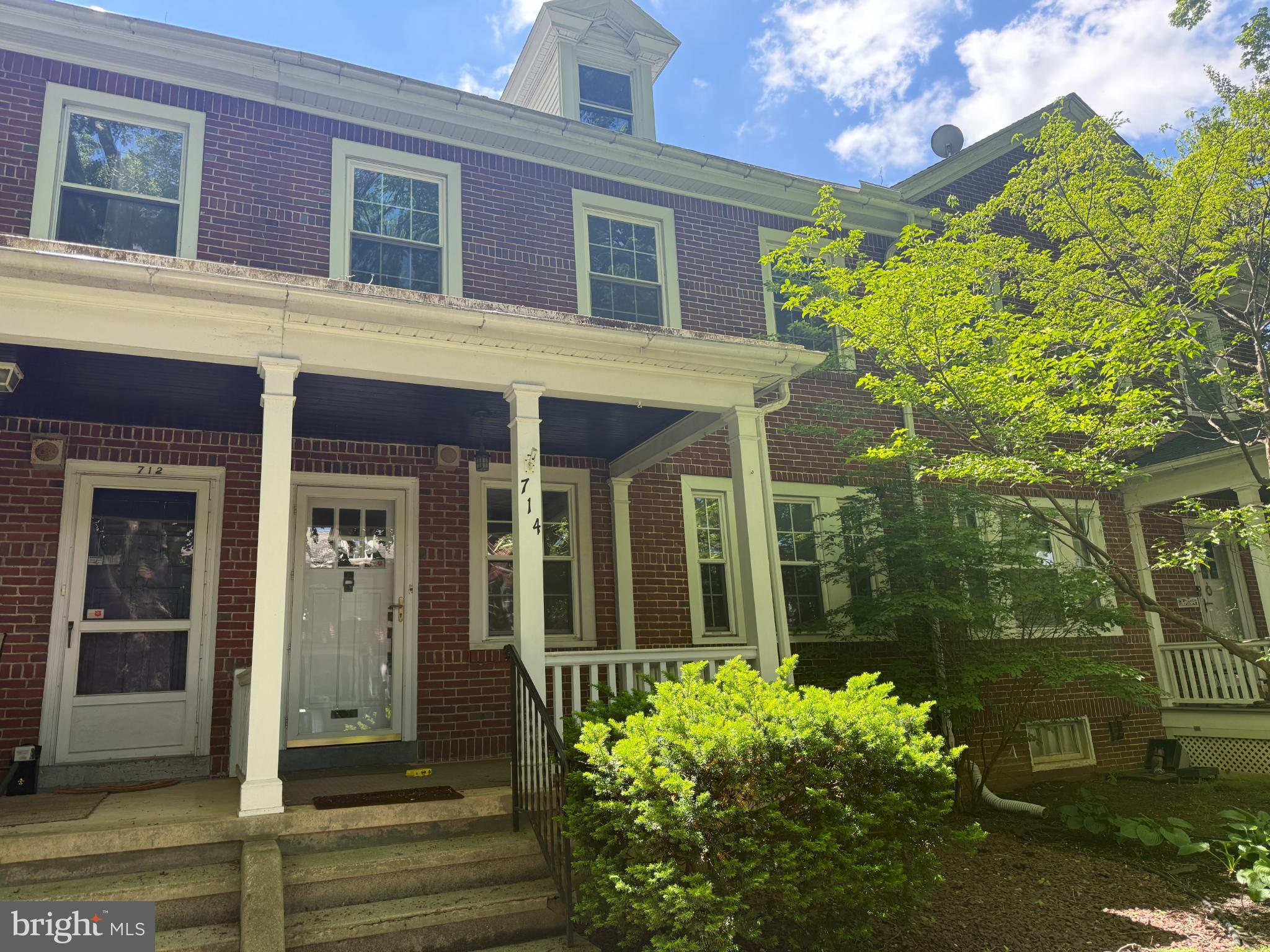 714 Wayne Avenue West Reading, PA 19611 - Photo 2 of 16 front view of a brick house with a large window