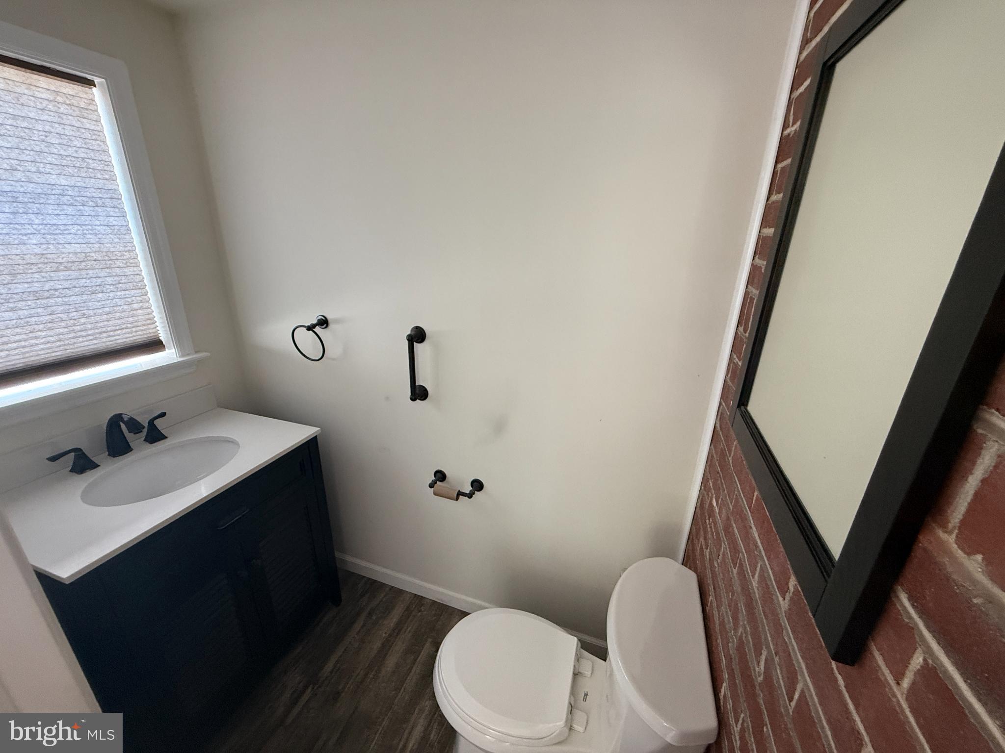 714 Wayne Avenue West Reading, PA 19611 - Photo 7 of 16 a bathroom with a sink toilet and mirror