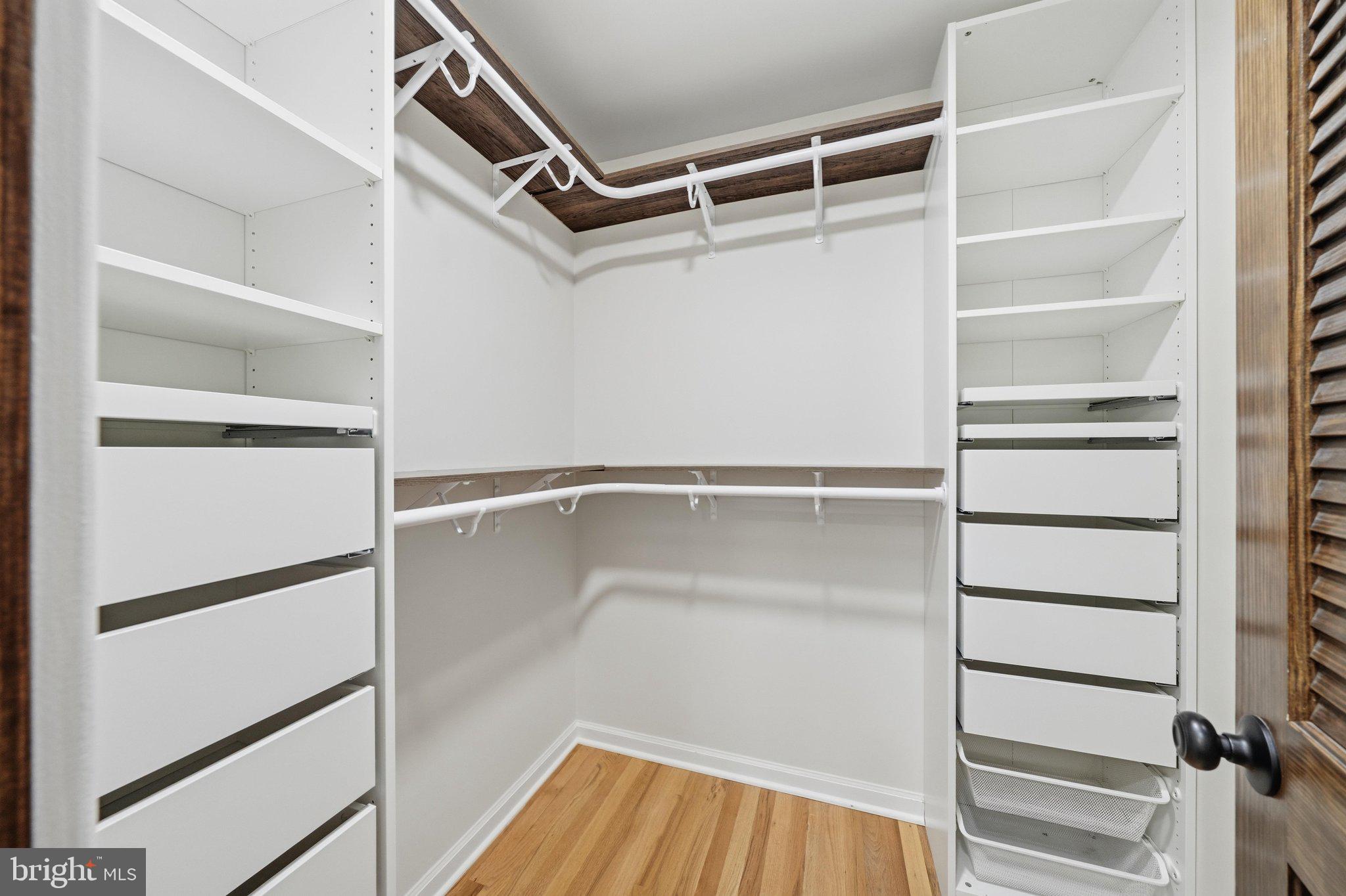 13120 Clifton Road Silver Spring, MD 20904 - Photo 34 of 69 a view of walk in closet with empty racks