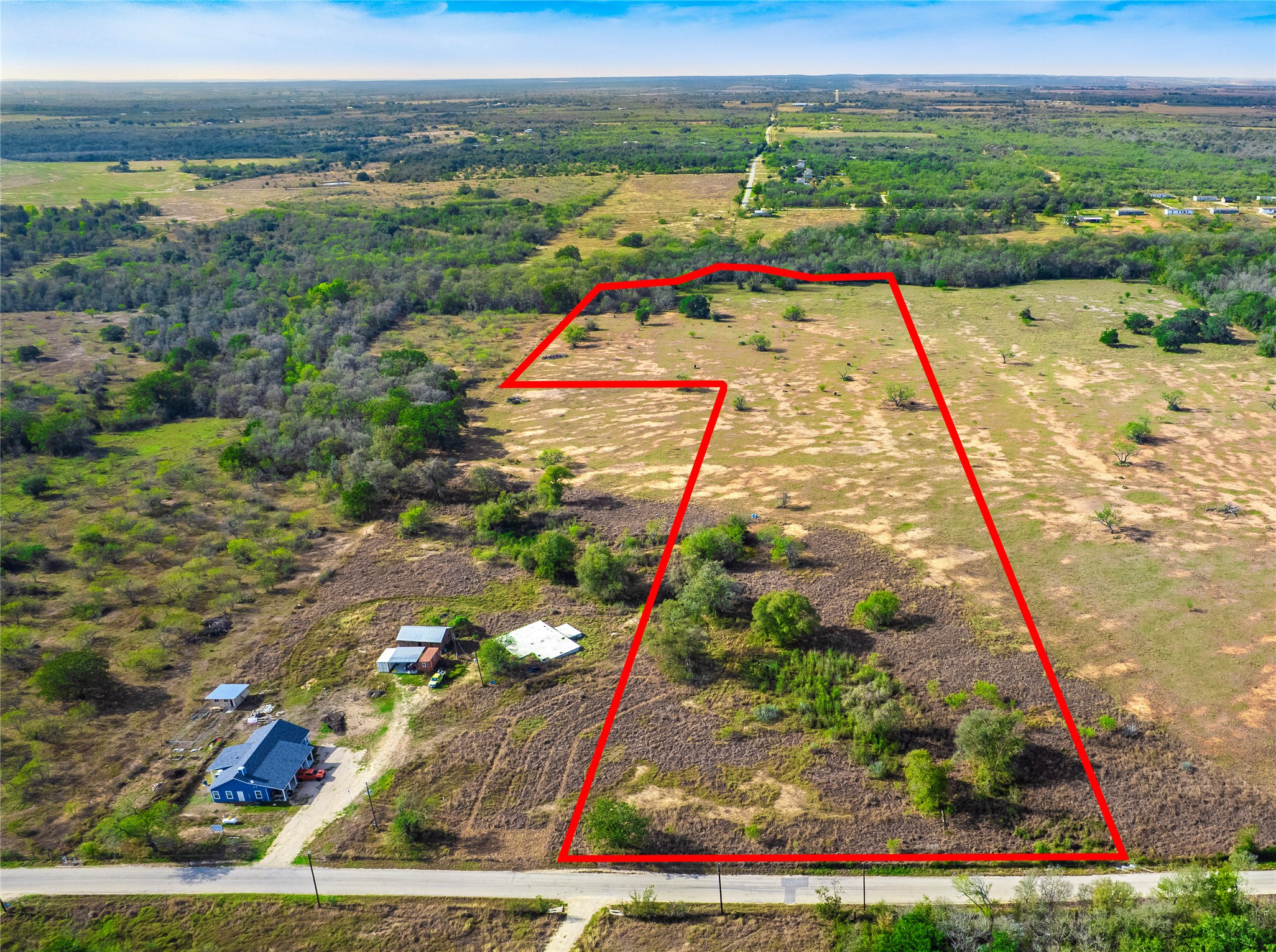 Overview of rural landscape with property parcel outlined