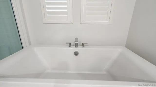 a view of a bathtub in a bathroom