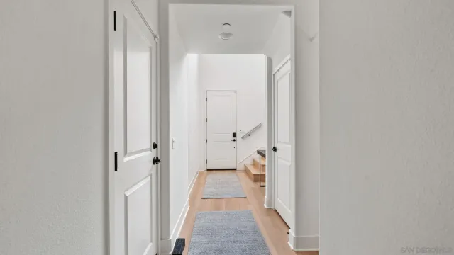 a view of a bathroom from a hallway