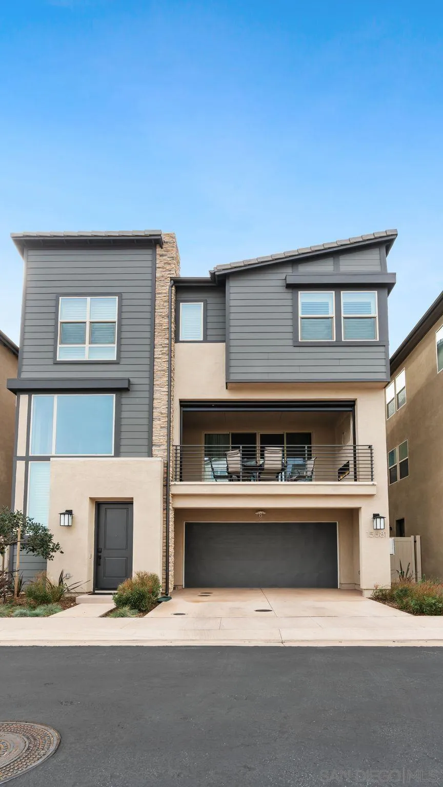15681 Rennyson Way San Diego, CA 92129 - Photo 36 of 36 a living room with a fireplace and a fireplace