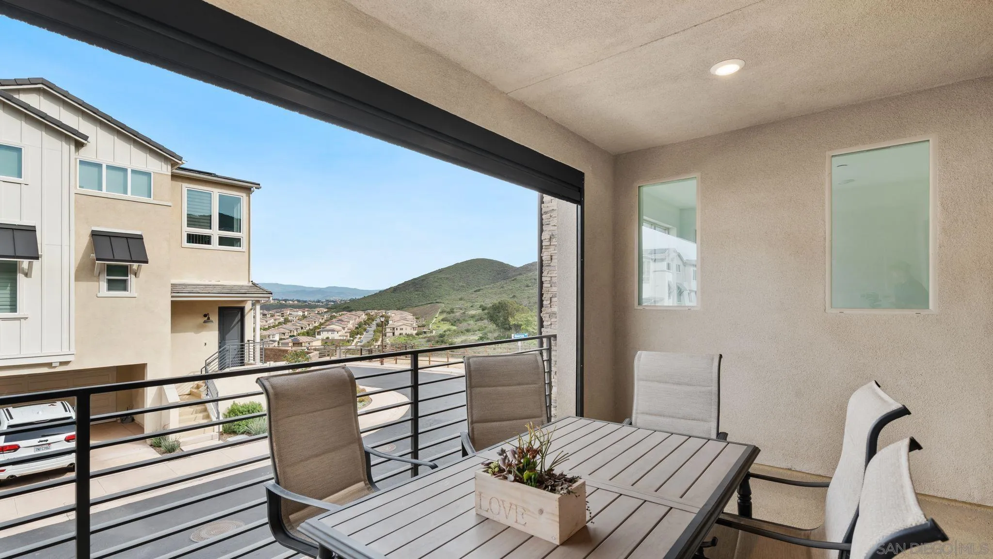 15681 Rennyson Way San Diego, CA 92129 - Photo 10 of 36 a view of a balcony with chair and the floor