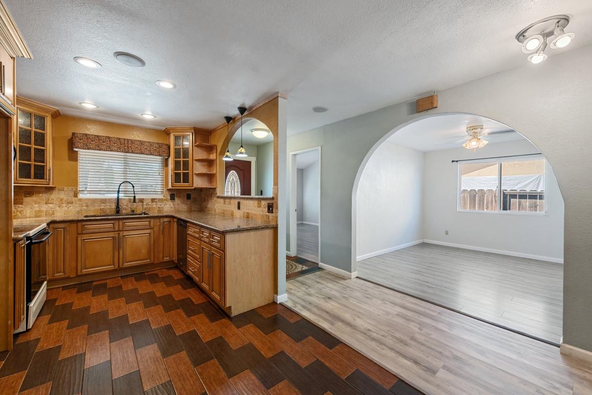 22 Sharon Drive Bay Point, CA 94565 - Photo 13 of 33 a large kitchen with stainless steel appliances kitchen island granite countertop a sink and cabinets