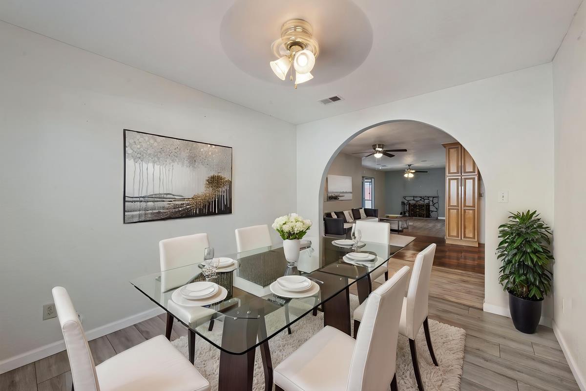 22 Sharon Drive Bay Point, CA 94565 - Photo 15 of 33 a dining room with furniture potted plants and wooden floor