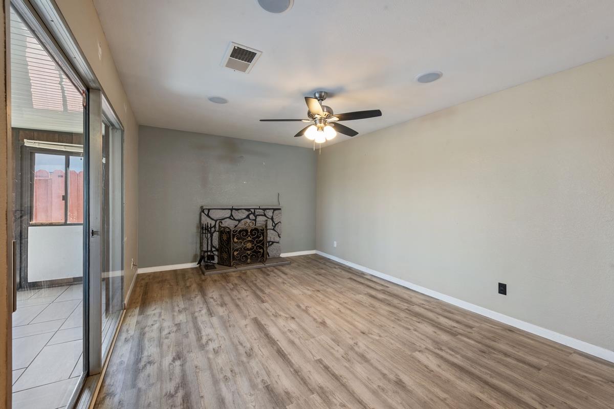 22 Sharon Drive Bay Point, CA 94565 - Photo 16 of 33 wooden floor in an empty room with a window