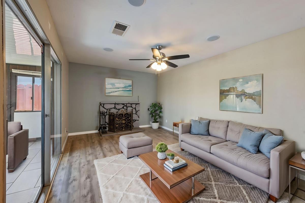 22 Sharon Drive Bay Point, CA 94565 - Photo 17 of 33 a living room with furniture a fireplace and a flat screen tv