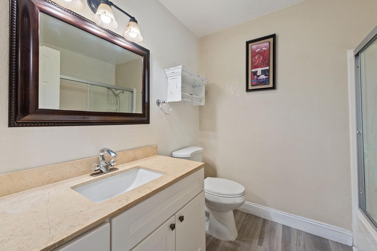 22 Sharon Drive Bay Point, CA 94565 - Photo 18 of 33 a bathroom with a toilet a sink and mirror