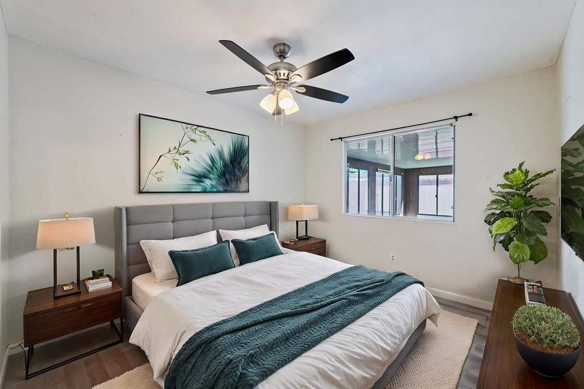 22 Sharon Drive Bay Point, CA 94565 - Photo 21 of 33 a bedroom with a bed and a potted plant