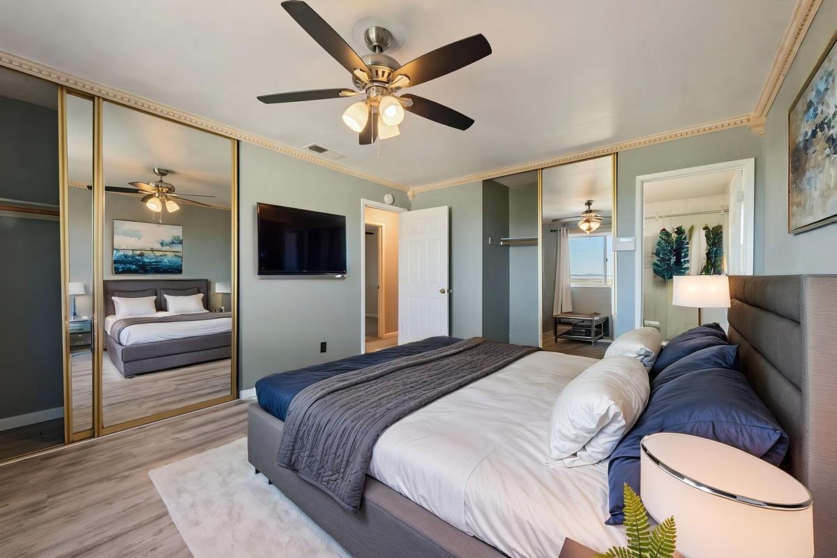 22 Sharon Drive Bay Point, CA 94565 - Photo 24 of 33 a bedroom with a bed couch and a flat tv screen