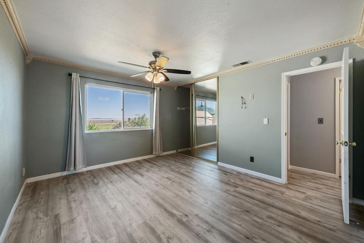22 Sharon Drive Bay Point, CA 94565 - Photo 26 of 33 a view of an empty room and window and wooden floor