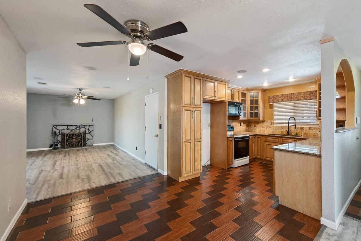 22 Sharon Drive Bay Point, CA 94565 - Photo 7 of 33 a kitchen with stainless steel appliances kitchen island granite countertop a refrigerator and a sink