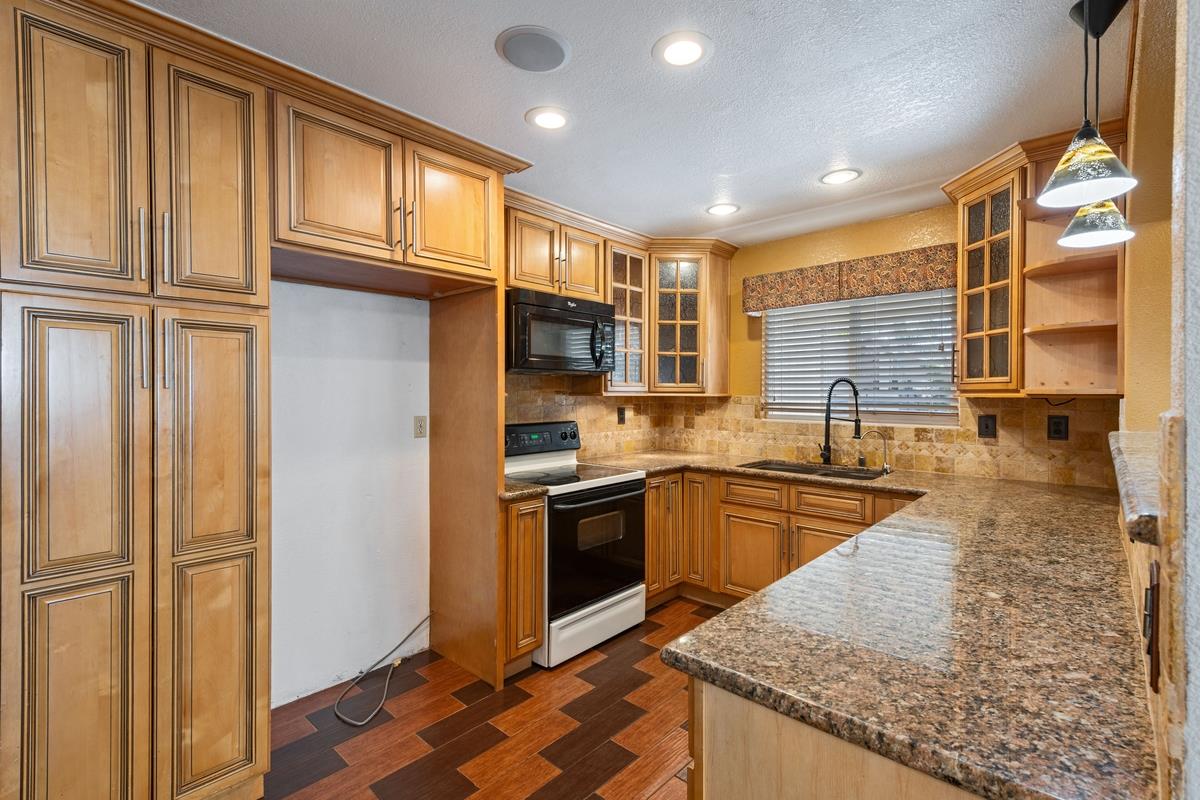 22 Sharon Drive Bay Point, CA 94565 - Photo 8 of 33 a kitchen with stainless steel appliances granite countertop a refrigerator and a sink