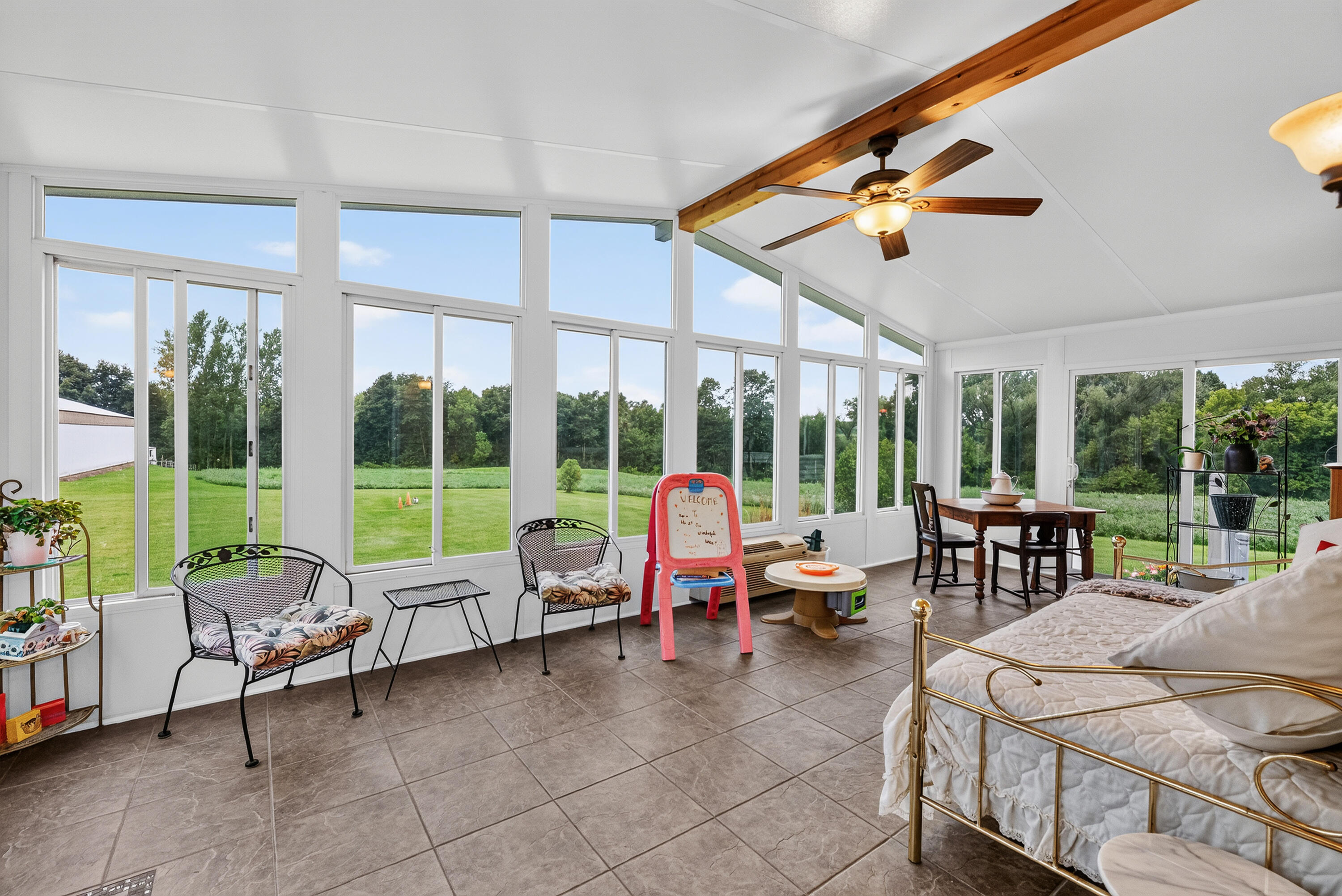 N6745 Mine Road Hubbard, WI 53035 - Photo 15 of 54 Vaulted ceiling. Beautiful full wall of windows overlooking the property.