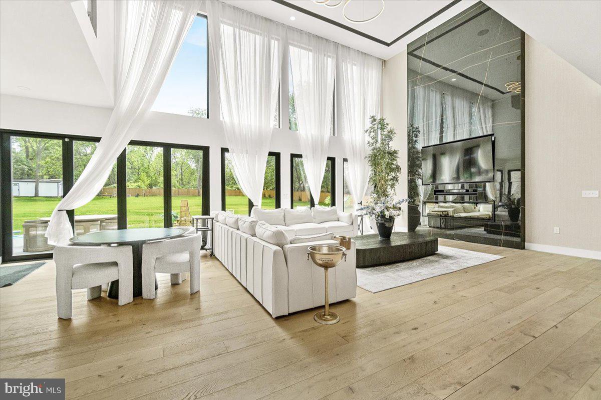 15807 Thompson Road Silver Spring, MD 20905 - Photo 14 of 82 a living room with furniture and large windows