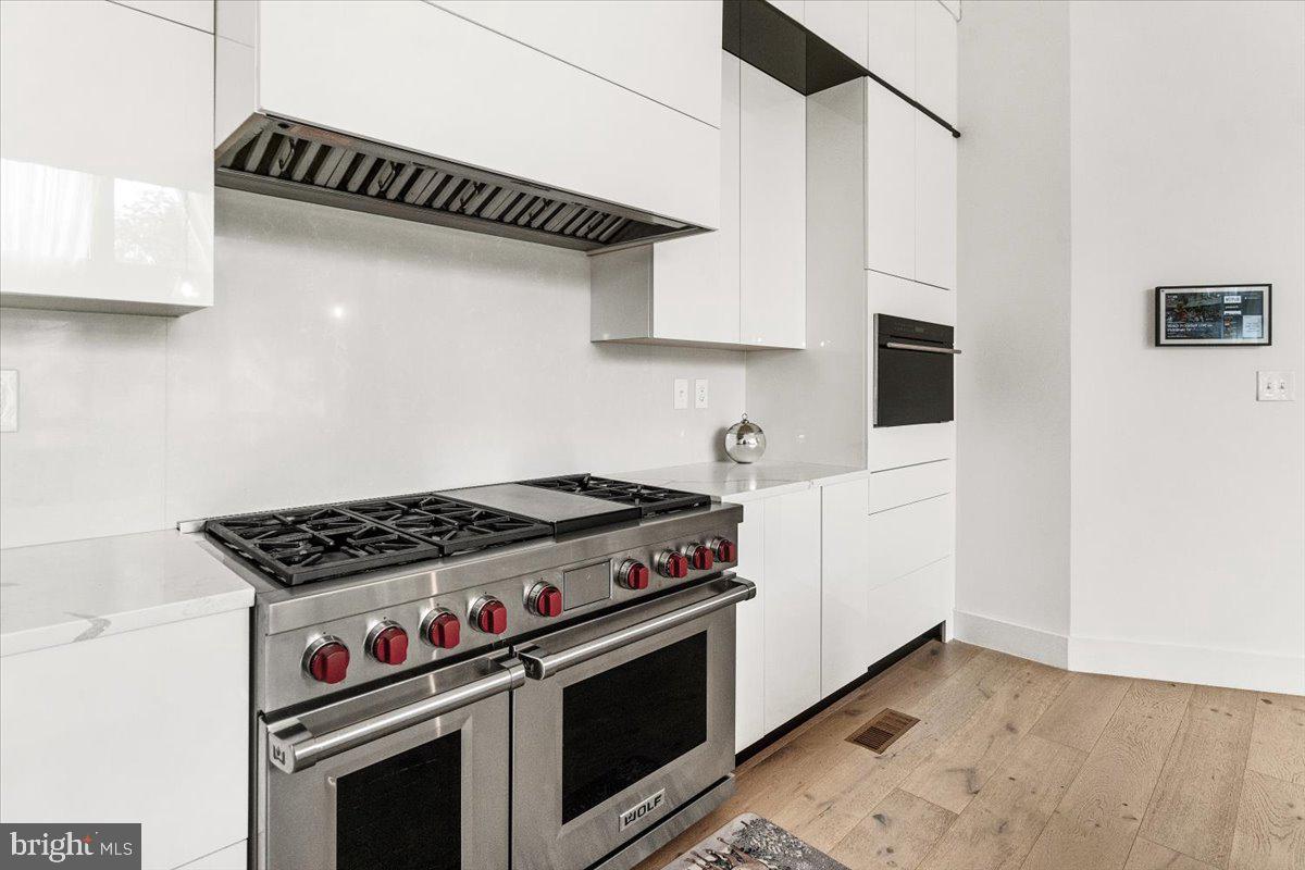 15807 Thompson Road Silver Spring, MD 20905 - Photo 21 of 82 a stove top oven sitting inside of a kitchen