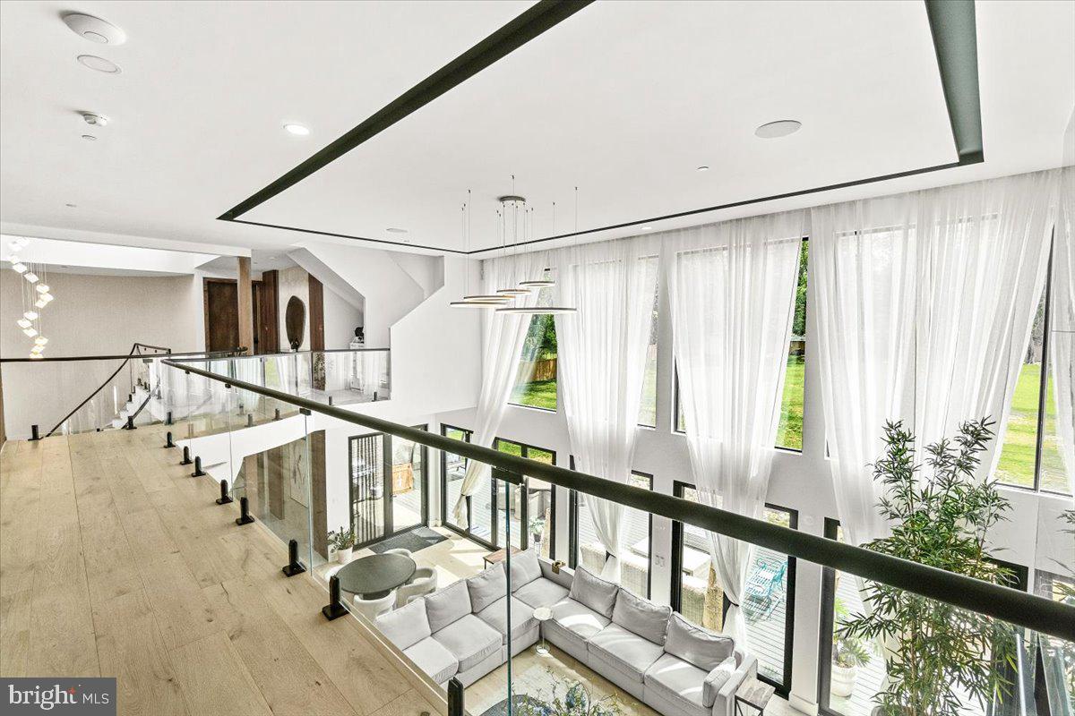 15807 Thompson Road Silver Spring, MD 20905 - Photo 43 of 82 a view of staircase with white walls and a window