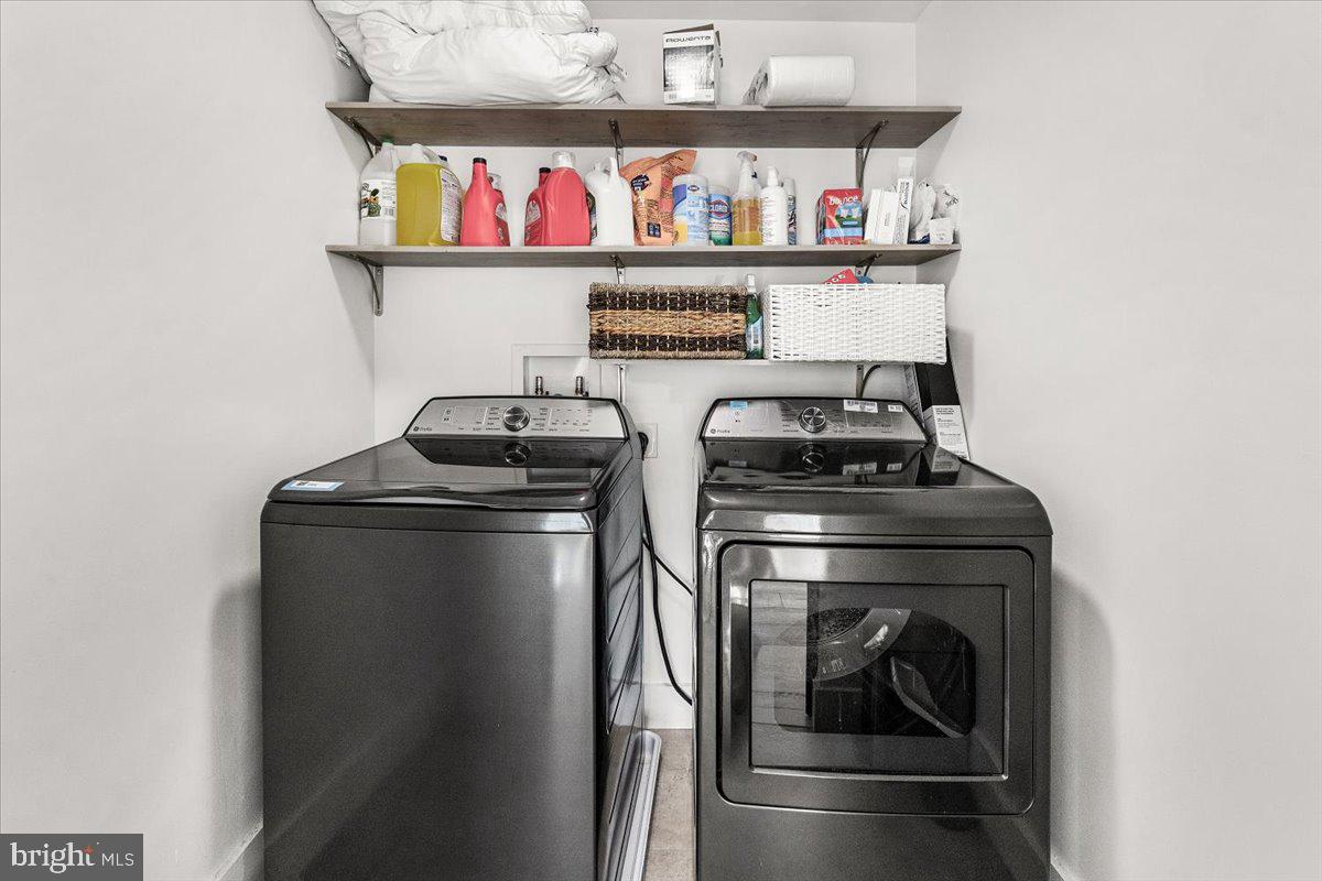 15807 Thompson Road Silver Spring, MD 20905 - Photo 44 of 82 a kitchen with a stove and a refrigerator