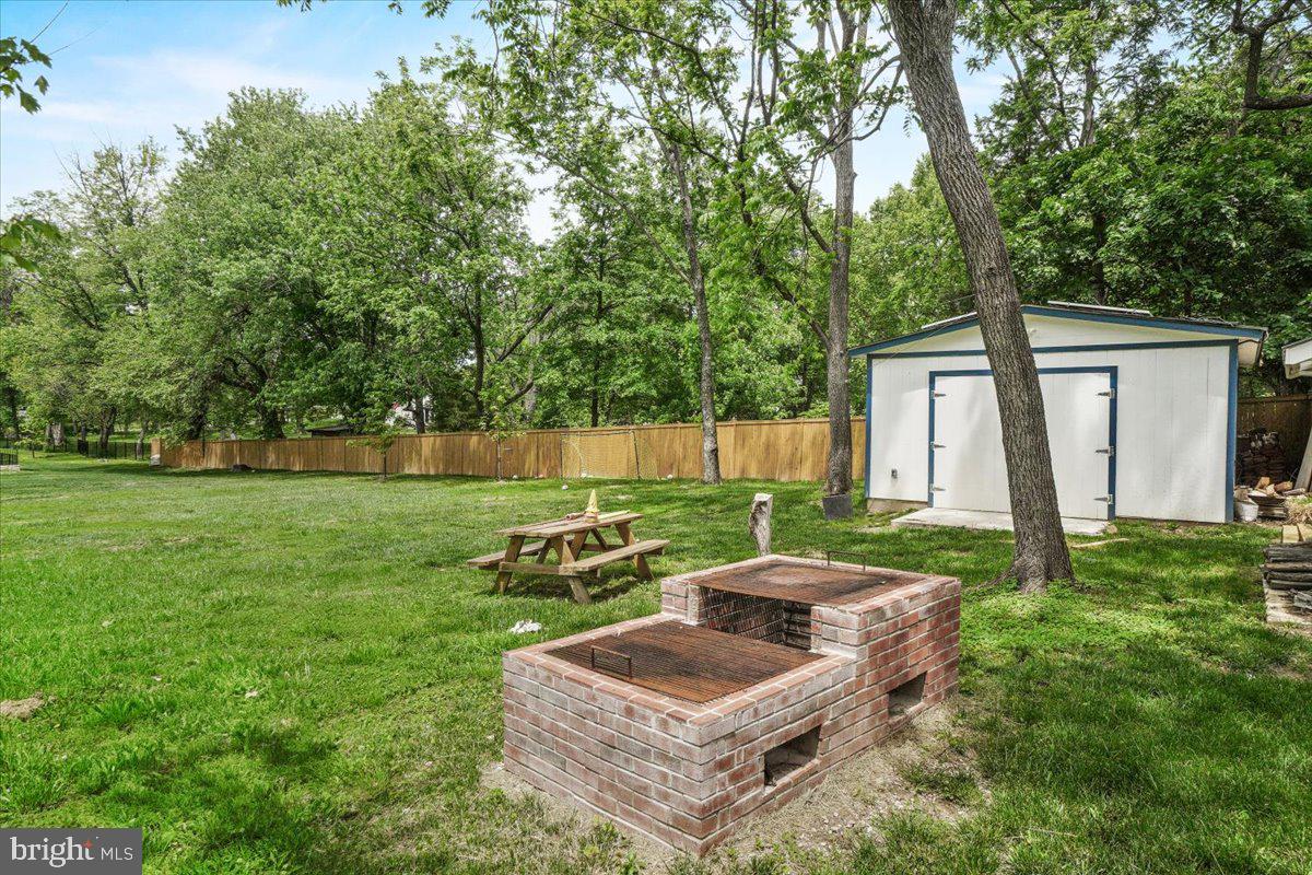 15807 Thompson Road Silver Spring, MD 20905 - Photo 74 of 82 a backyard of a house with outdoor seating