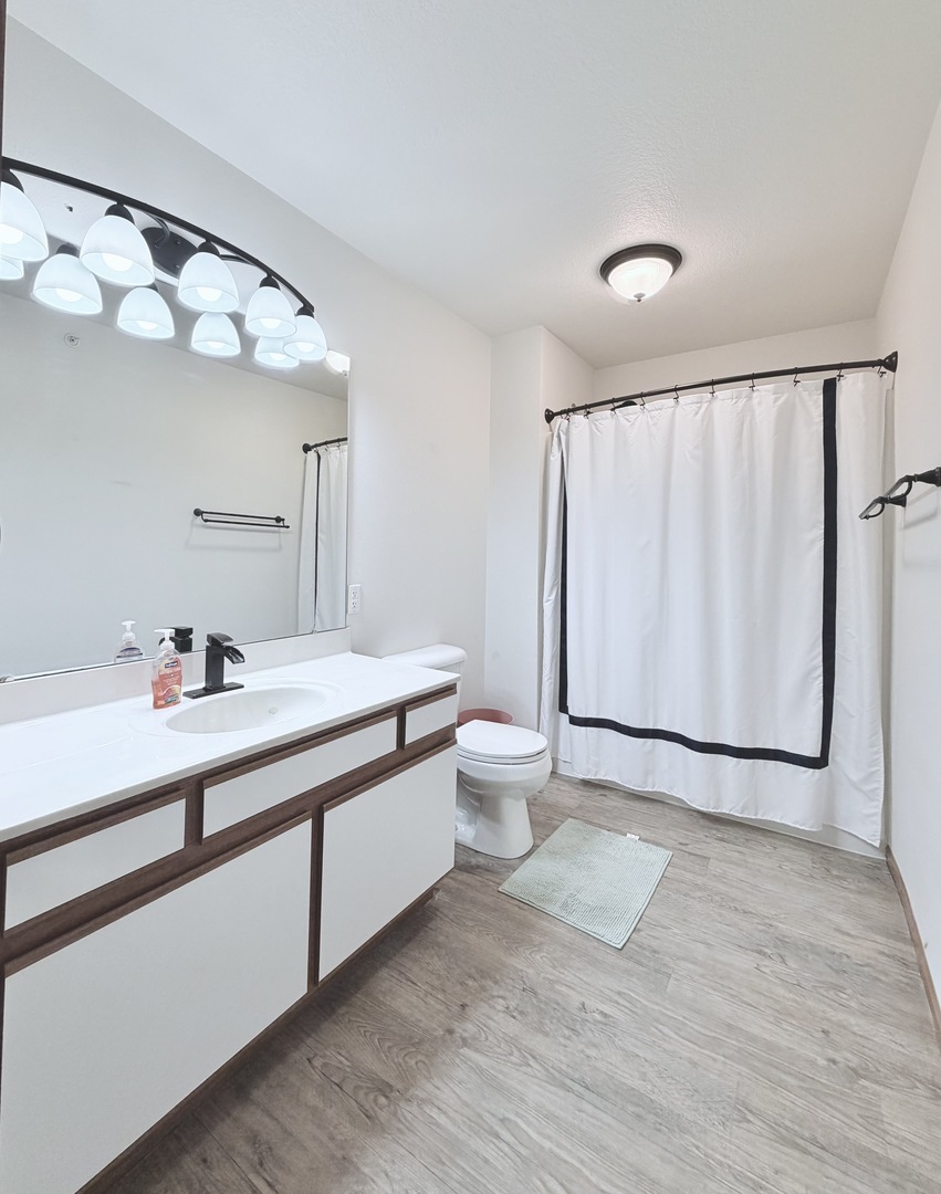 213 East Price Street, Unit 202 Eldridge, IA 52748 - Photo 19 of 20 a bathroom with a sink and a mirror