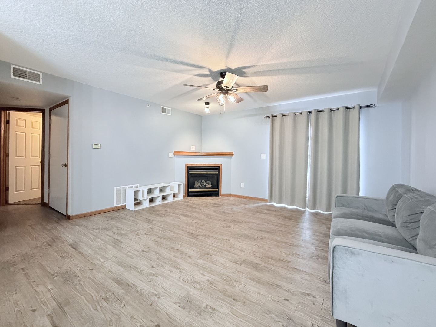 213 East Price Street, Unit 202 Eldridge, IA 52748 - Photo 7 of 20 a view of an empty room with a fireplace