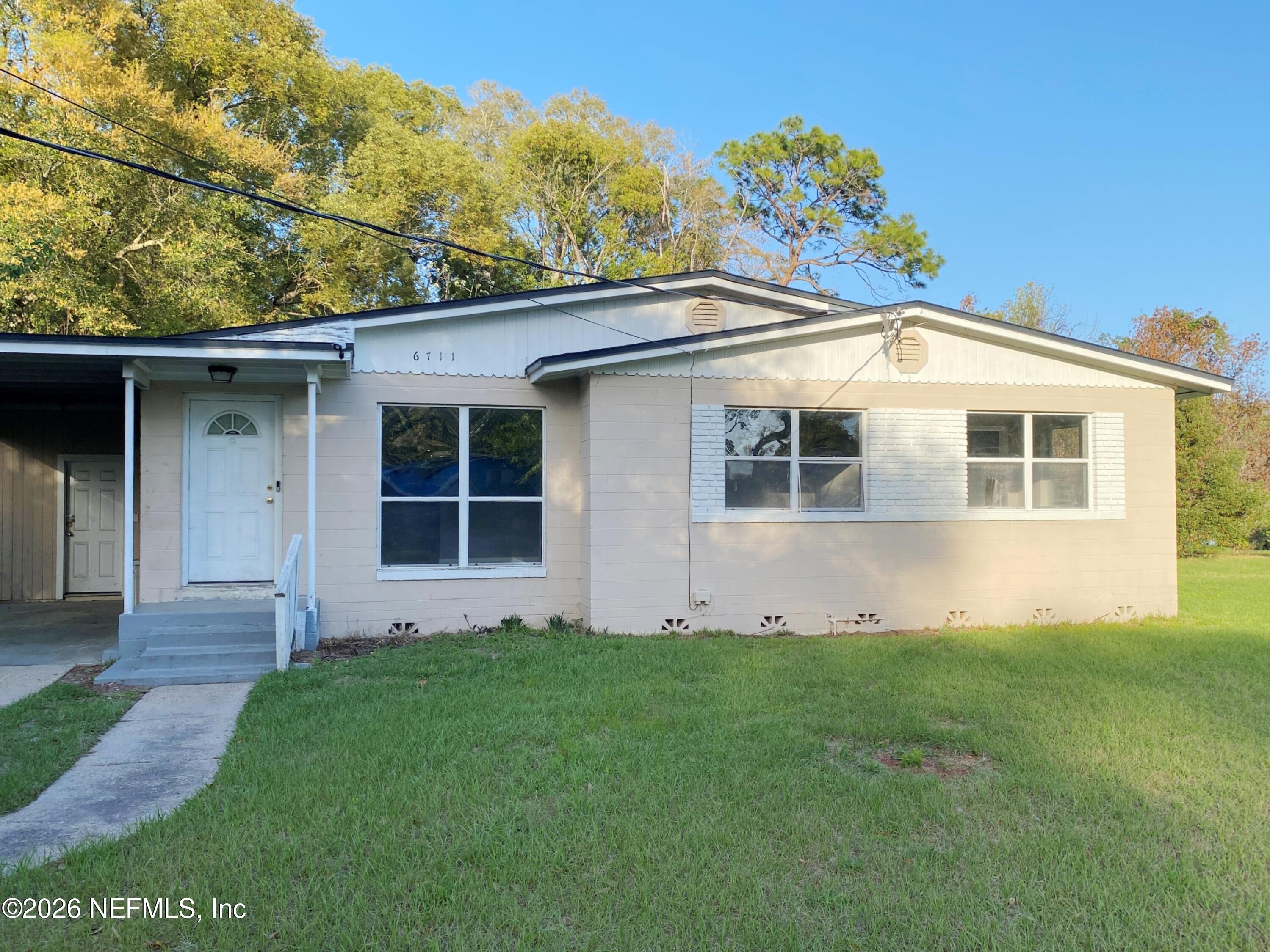 6711 Cavalier Road Jacksonville, FL 32208 - Photo 1 of 20 Front