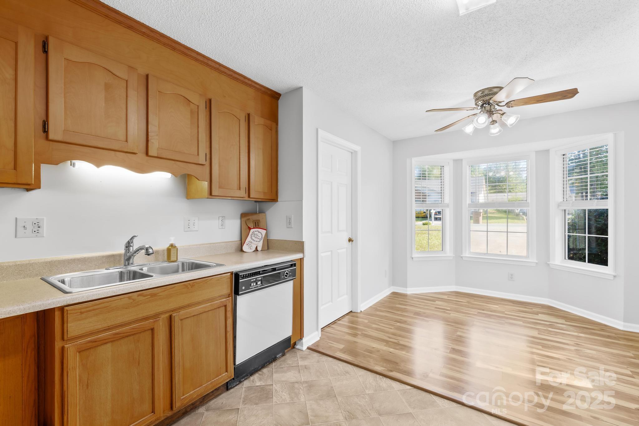 4805 Shea Court Monroe, NC 28110 - Photo 17 of 35 a kitchen with a sink cabinets and window