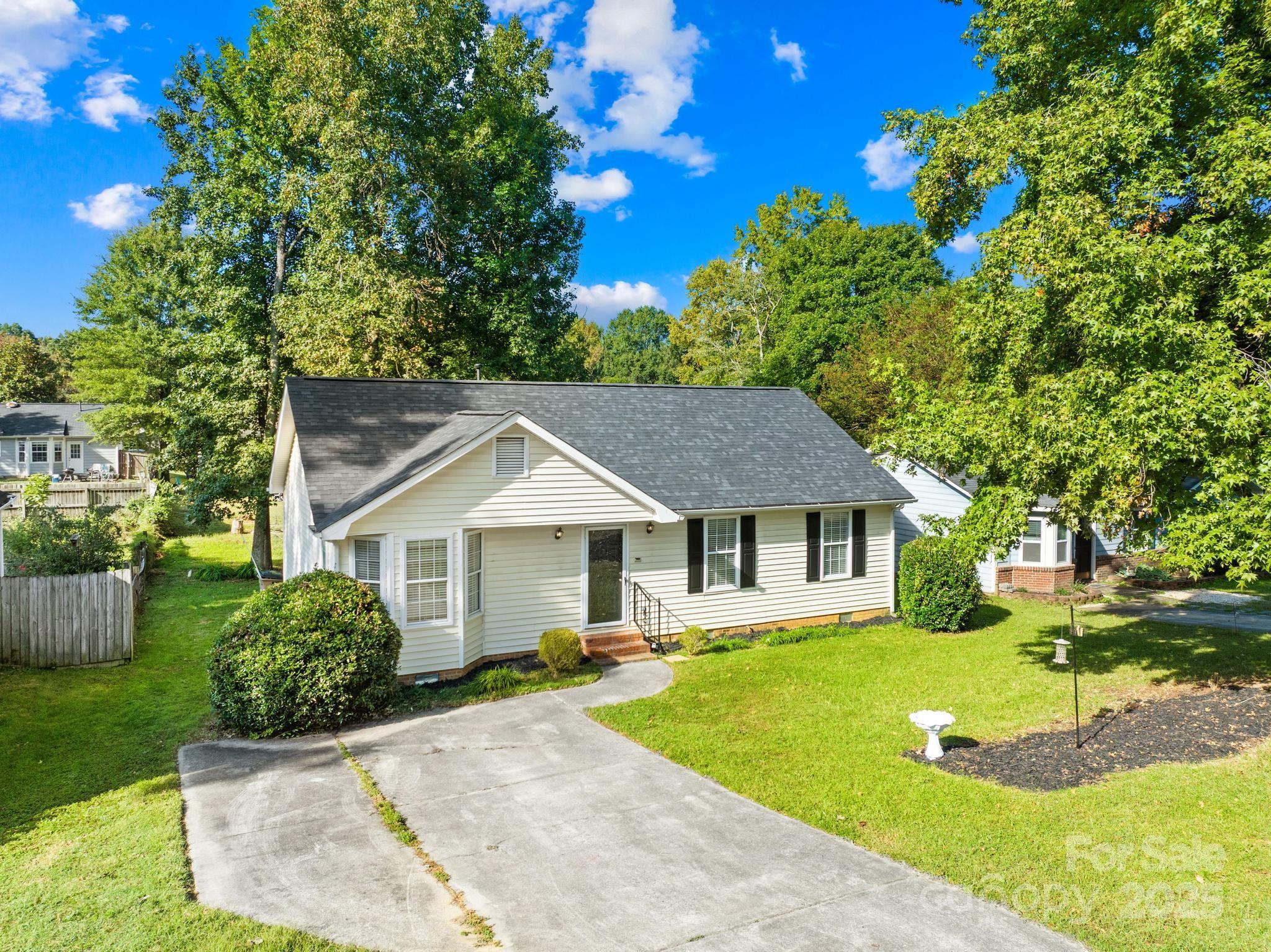 4805 Shea Court Monroe, NC 28110 - Photo 25 of 35 a front view of a house with a yard
