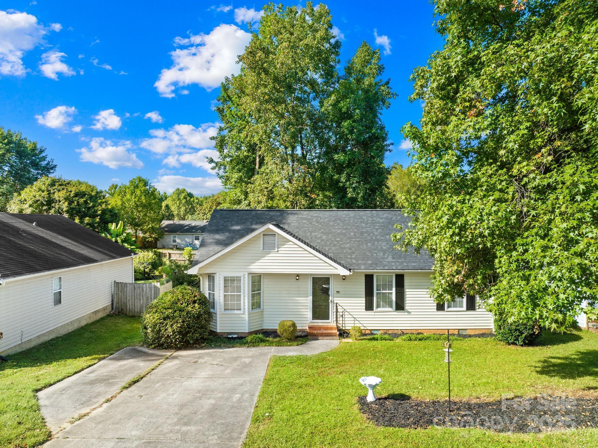4805 Shea Court Monroe, NC 28110 - Photo 26 of 35 a front view of a house with a garden