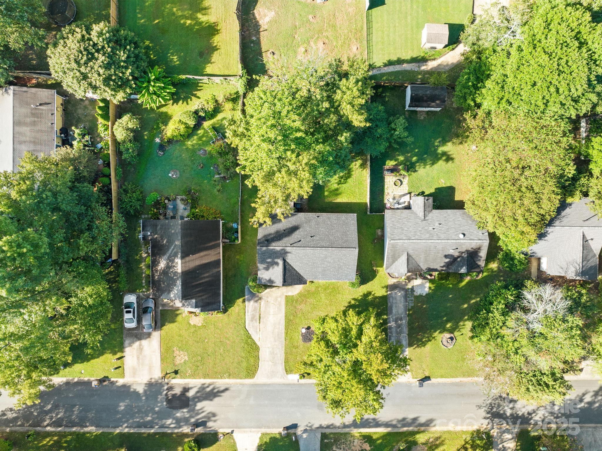 4805 Shea Court Monroe, NC 28110 - Photo 28 of 35 a view of a yard with plants and a fountain