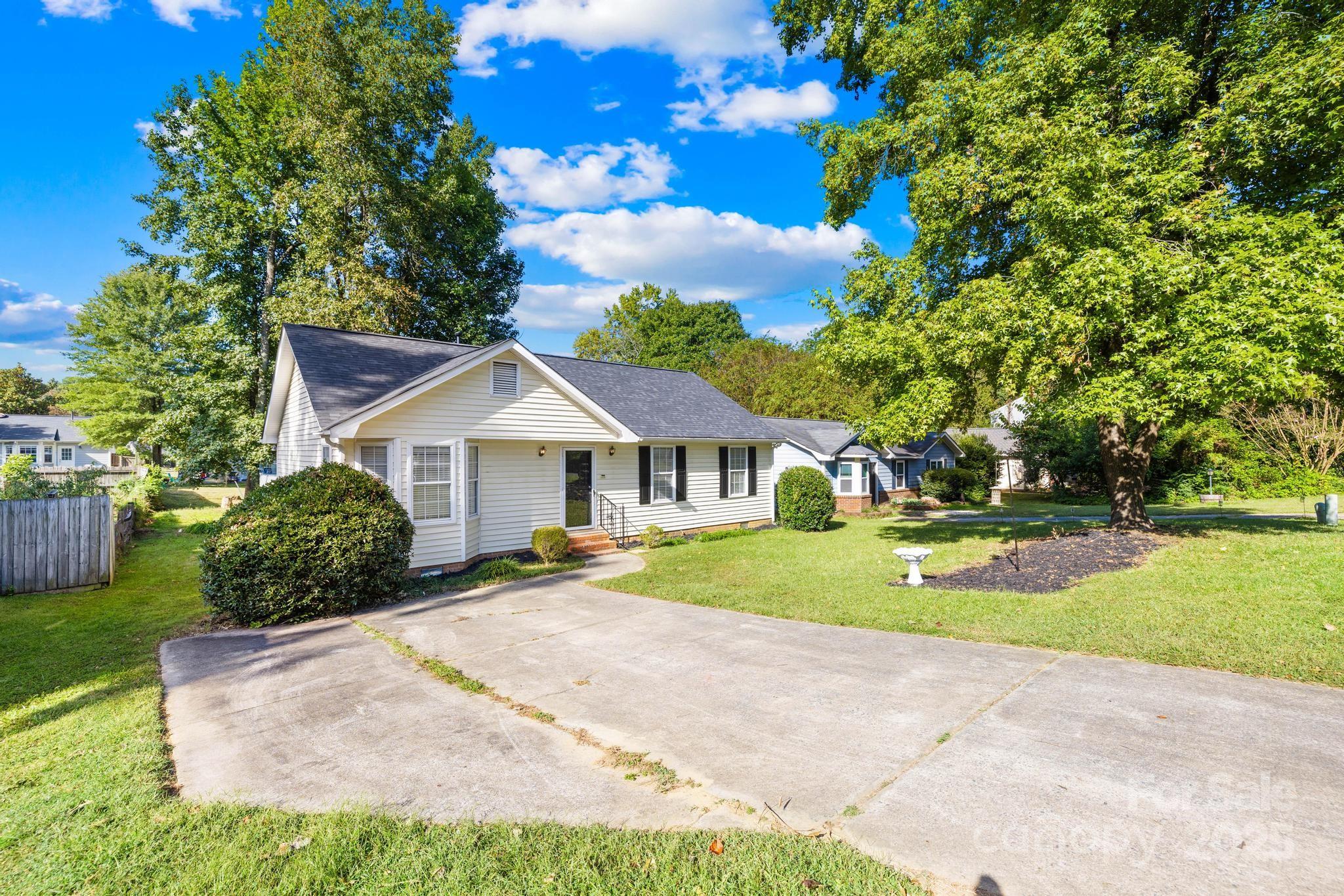 4805 Shea Court Monroe, NC 28110 - Photo 3 of 35 a front view of a house with garden