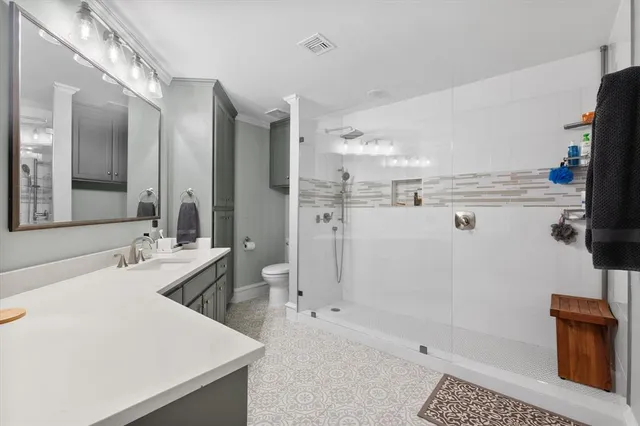 a bathroom with a tub sink and mirror