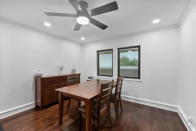 a view of a dining room with furniture and wooden floor