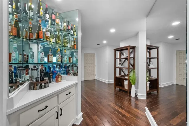 a kitchen with stainless steel appliances granite countertop a refrigerator and a counter space