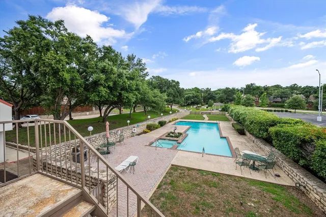 a view of an outdoor space with swimming pool