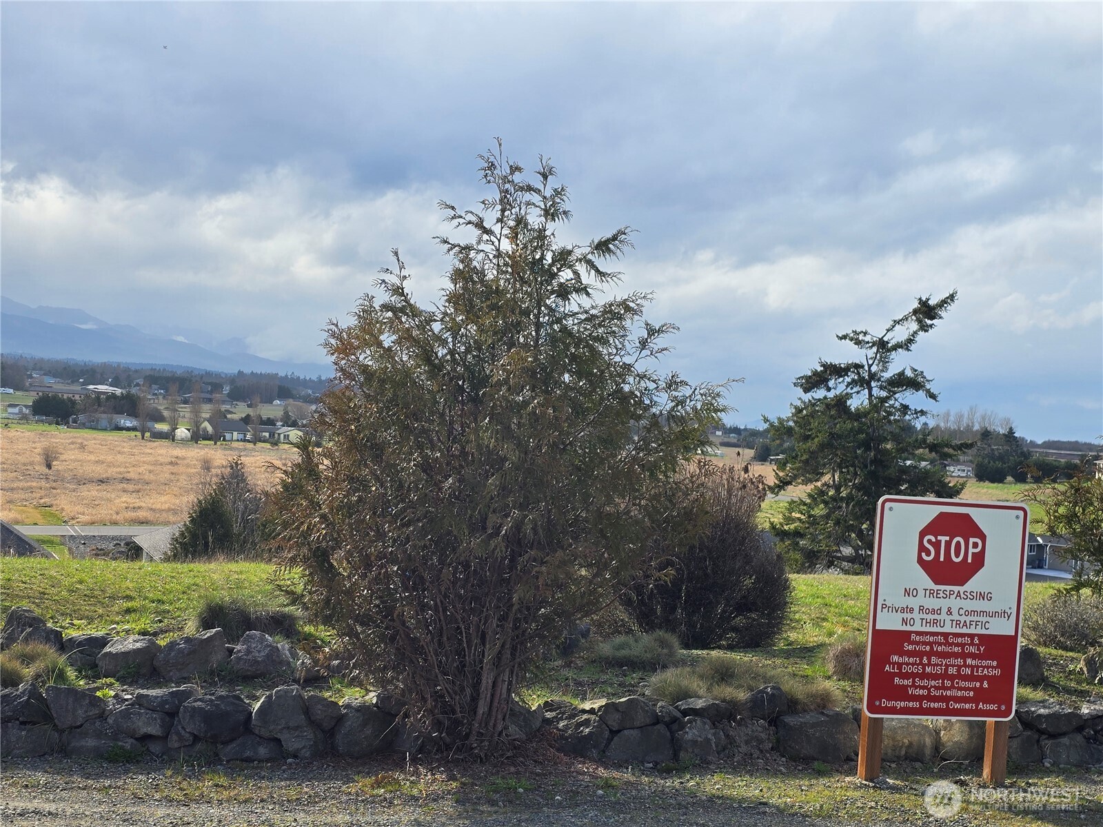 104 Green Valley Lane Sequim, WA 98382 - Photo 12 of 12 a view of sign board with lake in background