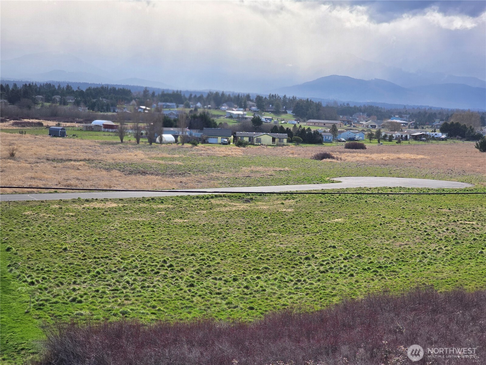 104 Green Valley Lane Sequim, WA 98382 - Photo 9 of 12 a view of a city with an ocean view