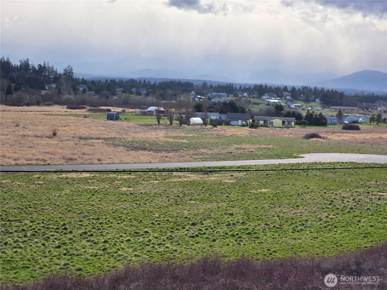 104 Green Valley Lane Sequim, WA 98382 - Photo 10 of 12 a view of a lake with a city