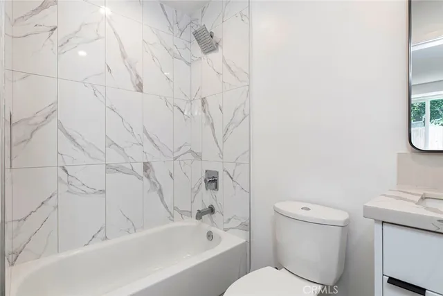 a bathroom with a toilet and a sink