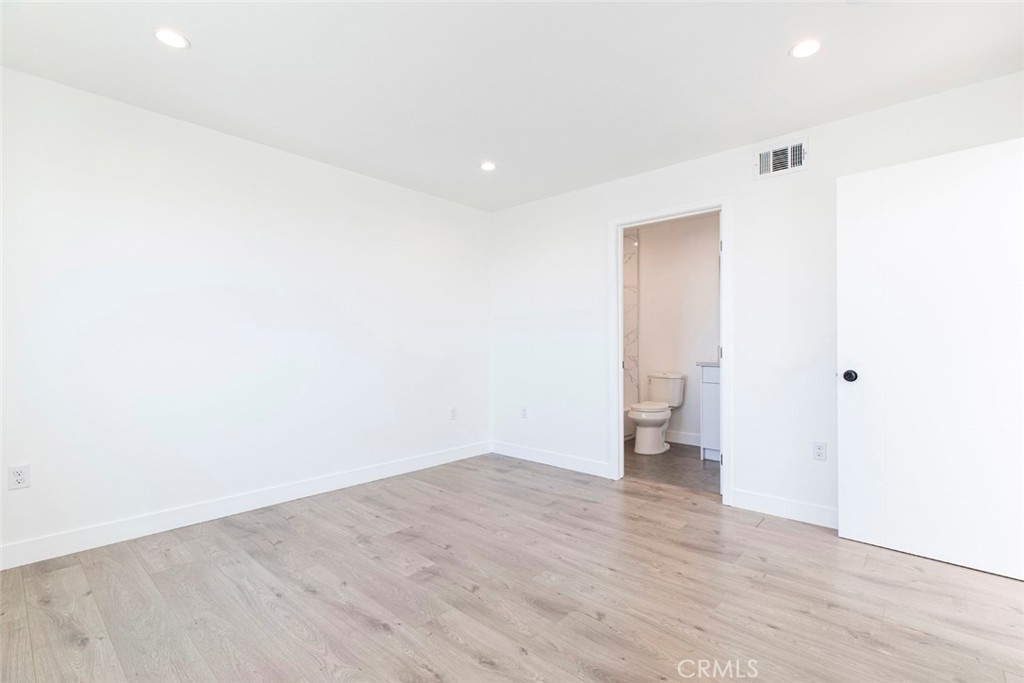 1843 West 20th Street Los Angeles, CA 90007 - Photo 26 of 38 a view of an empty room with wooden floor and a window